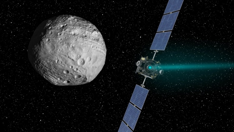 an illustration of a spacecraft next to Vesta in outer space
