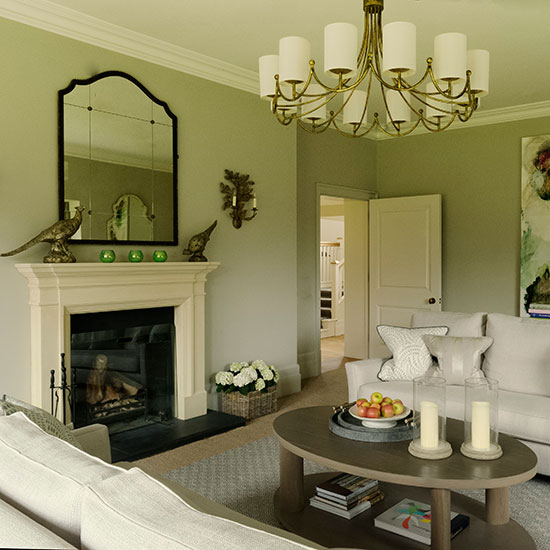 living room with sofa and cushions artwork fireplace and coffee table and light fittings