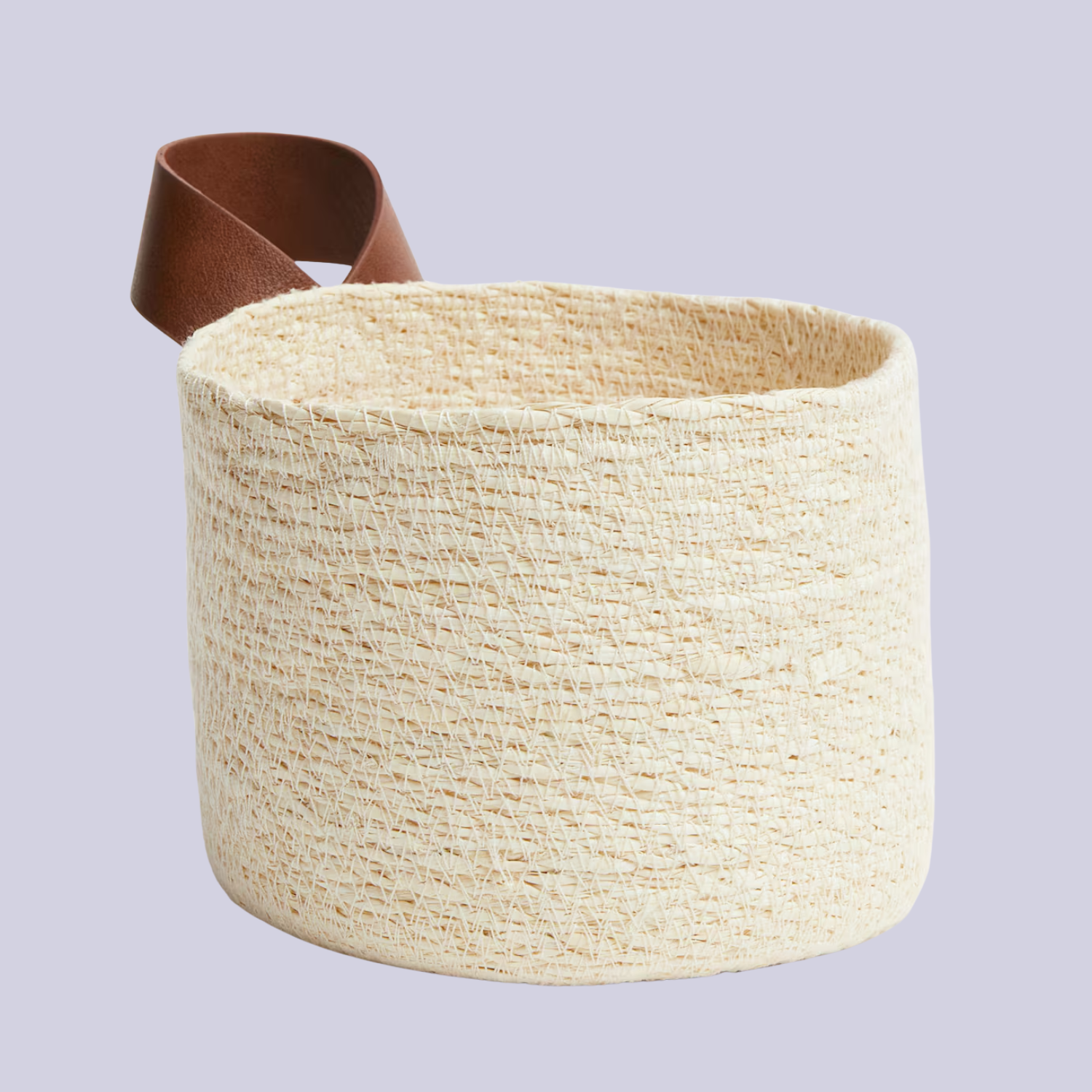 A woven seagrass basket with a leather handle