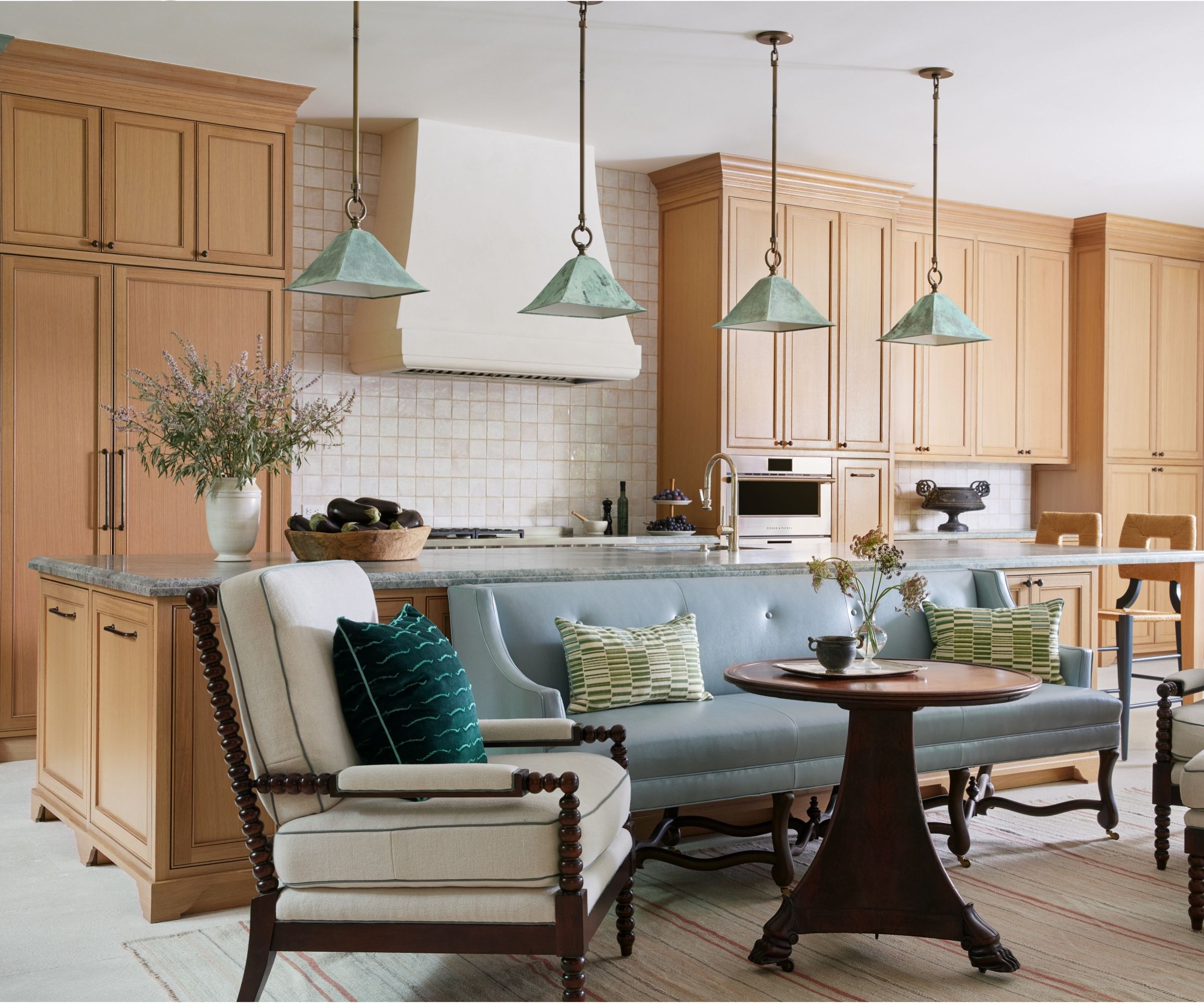 An open plan wooden kitchen connected to a living space