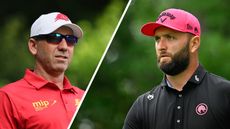 Sergio Garcia (left) looks on through sunglasses while Jon Rahm (right) looks on under his pink Callaway cap