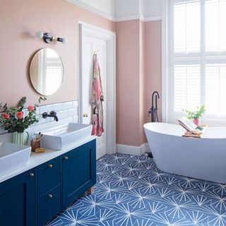 peach and blue bathroom with vanity unit