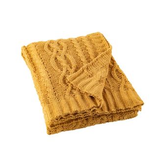 A mustard colored knitted blanket