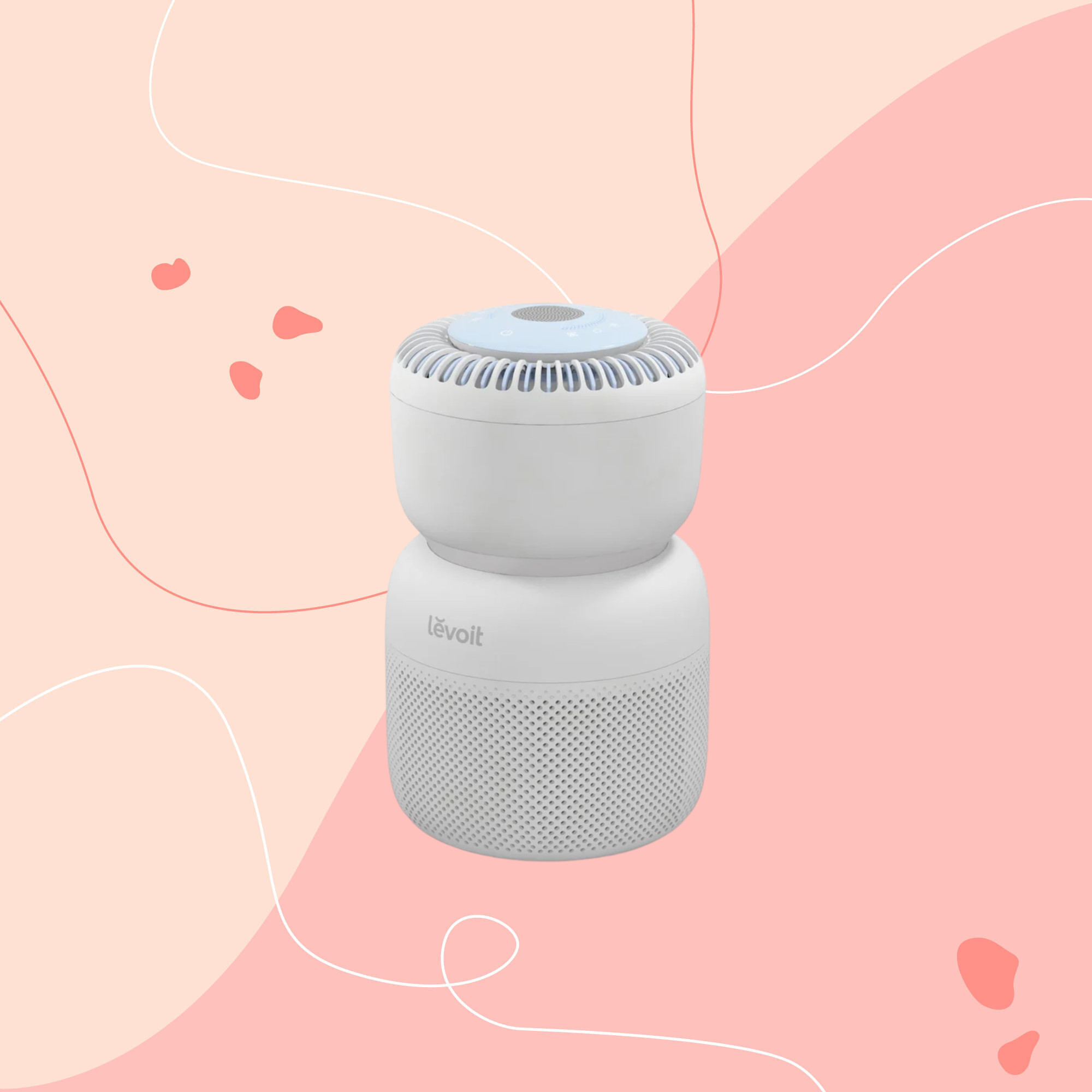 levoit sprout air purifier on a pink graphic background