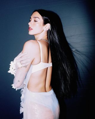 A photo of the 29-year-old posing in a practically backless design with a bra-inspired closure.