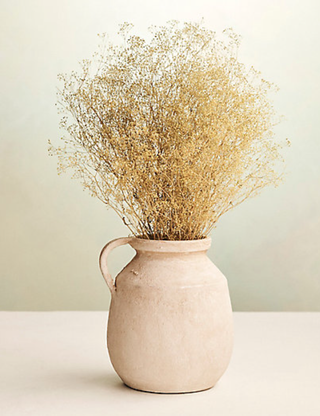 dried gypsophila in a stoneware vase