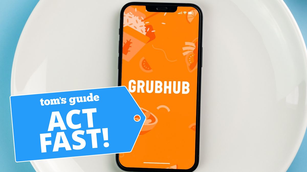 Grubhub app on iPhone with phone on plate