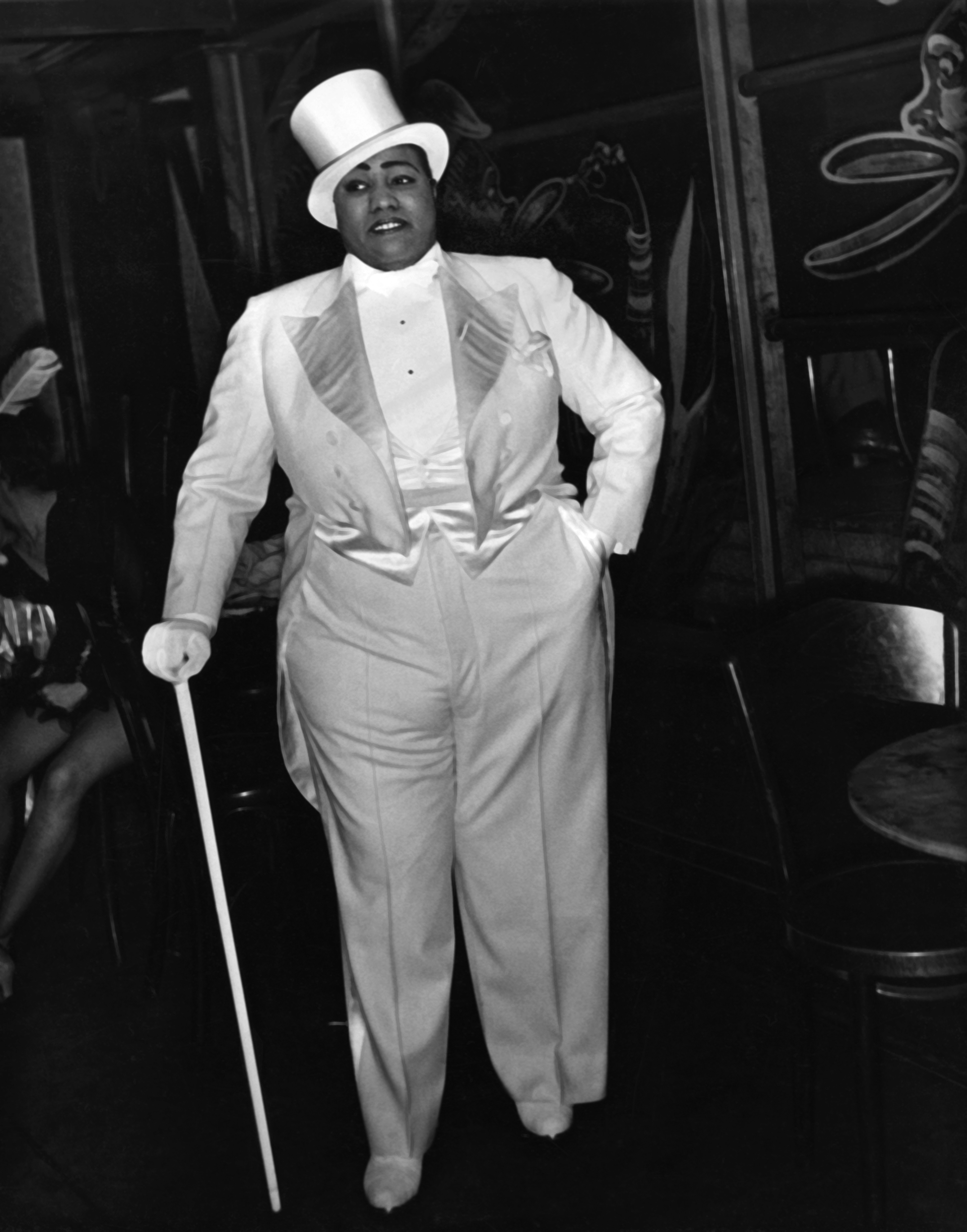 Portrait of American Blues musician Gladys Bentley (1907 - 1960), in a tuxedo, top hat, & gloves, as she holds a walking cane at Harlem's Ubangi Club, New York, New York, circa 1930.