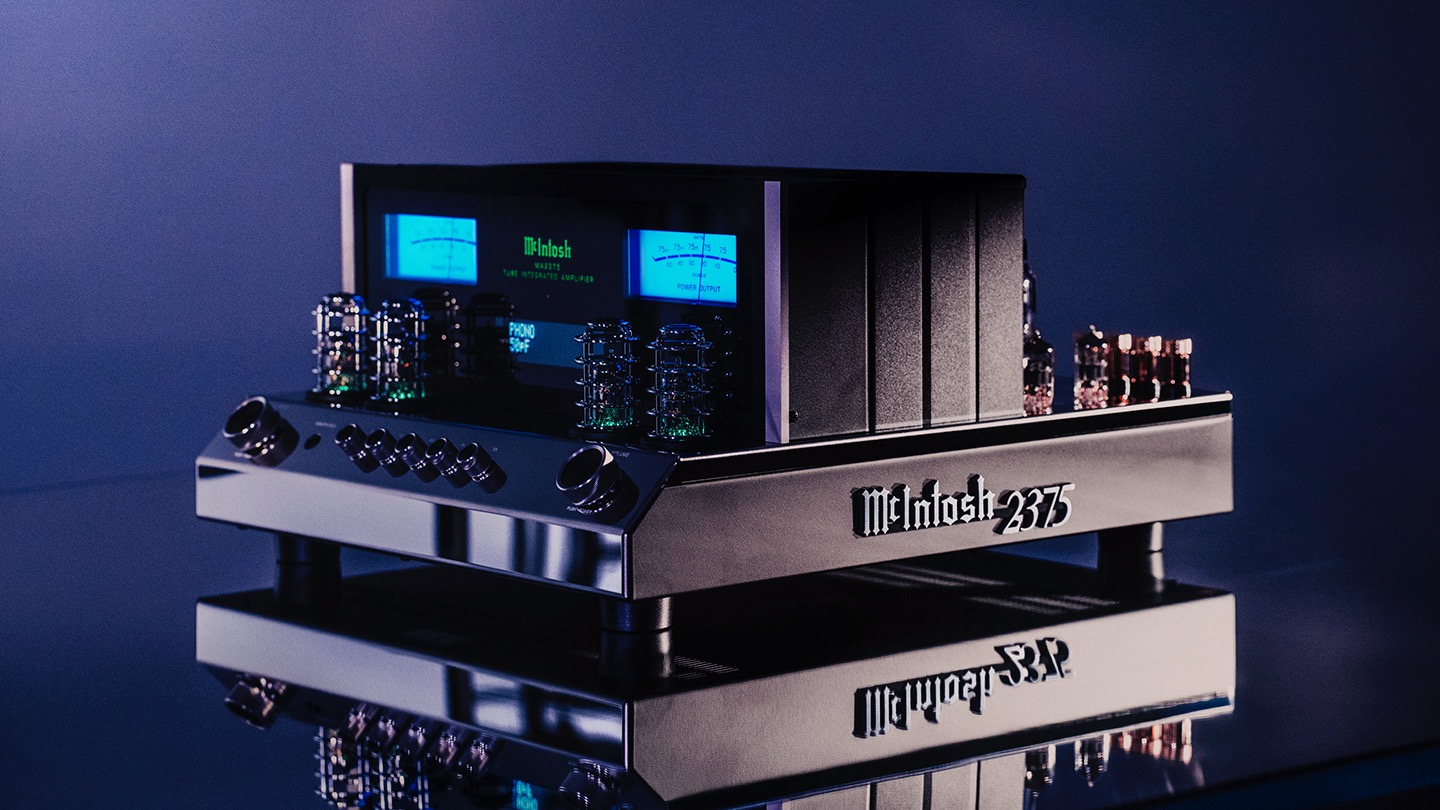The McIntosh MA2375 vacuum tube integrated amplifier on a reflective blue surface.