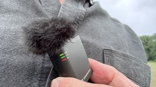Close-up of the transmitter mic wearing a fluffy windshield