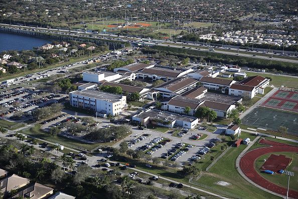 Assistant football coach killed in Florida school shooting deemed a ...