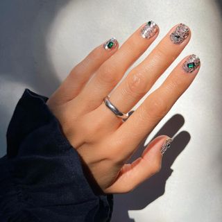 Shattered metal manicure with emerald details by Betina Goldstein