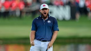 Tyrrell Hatton roars in delight after holing the winning putt at the 2025 Hero Dubai Desert Classic