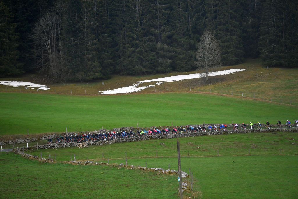 SAINTIMIER SWITZERLAND APRIL 29 The Peloton passing through Les Bugnenets 1116m during the 74th Tour De Romandie 2021 Stage 2 a 1657km stage from La Neuveville to SaintImier TDR2021 Landscape Forest Snow TDRnonstop UCIworldtour on April 29 2021 in SaintImier Switzerland Photo by Luc ClaessenGetty Images