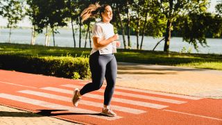 Woman running on track