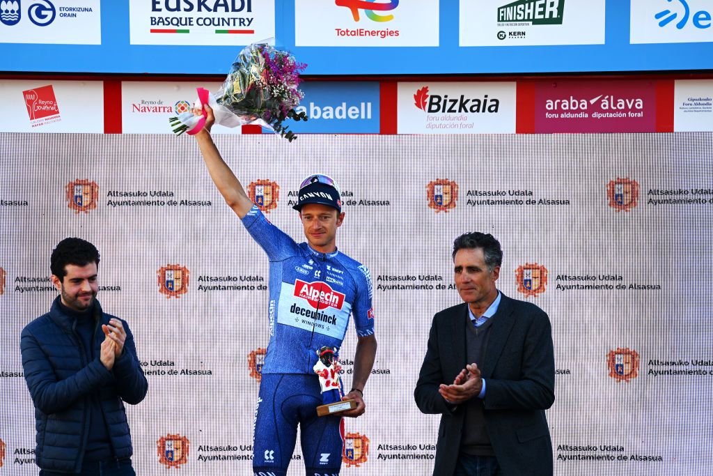 ALTSASU SPAIN APRIL 03 LR Quinten Hermans of Belgium and Team Alpecin Deceuninck celebrates at podium as stage winner near Miguel Indurain of Spain five times Tour de France winner during the 63rd Itzulia Basque Country 2024 Stage 3 a 1909km stage from Ezpeleta to Altsasu 526m UCIWT on April 03 2024 in Altsasu Spain Photo by Tim de WaeleGetty Images