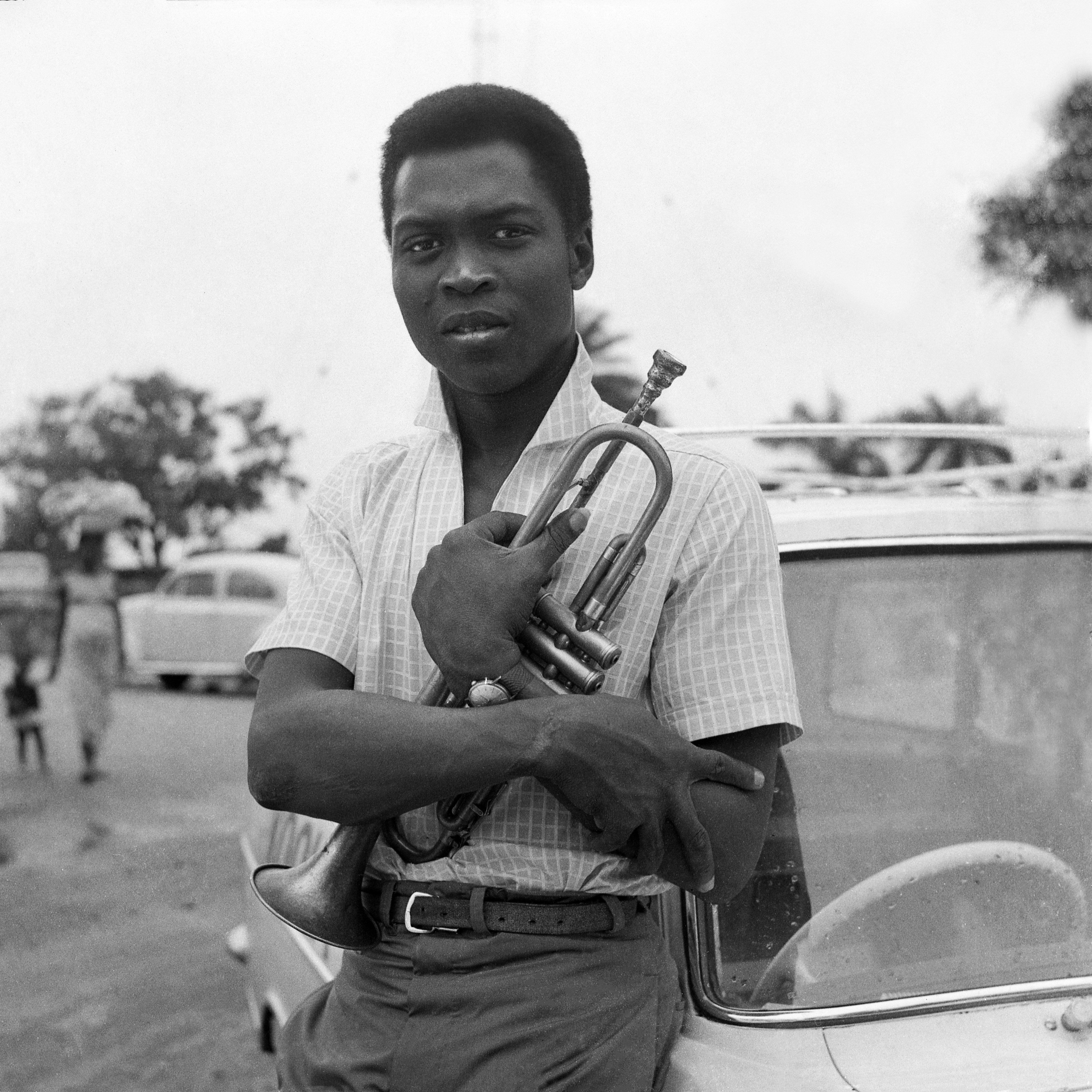 Fela Kuti posing with his trumpet in 1966