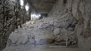The dump of rubble and artifacts in the Middle Kingdom tomb.