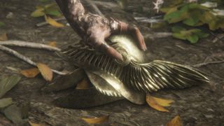 The Elden Ring Malenia boss cutscene - a rotten hand grasps a golden, winged helm resting on the ground