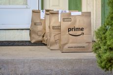 Paper bags of Amazon Prime groceries sitting on a doorstep