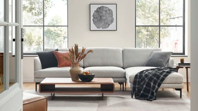 A modern grey sectional sofa in a contemporary living room