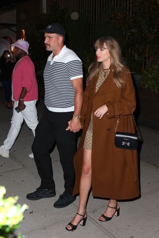 Taylor Swift wears a gucci mini dress and gucci heels with a gant coat on a date with Travis Kelce