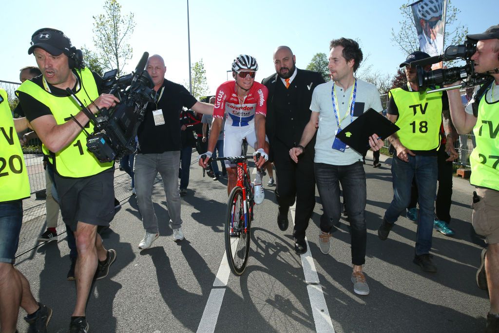Mathieu van der Poel rides through the press after the finish