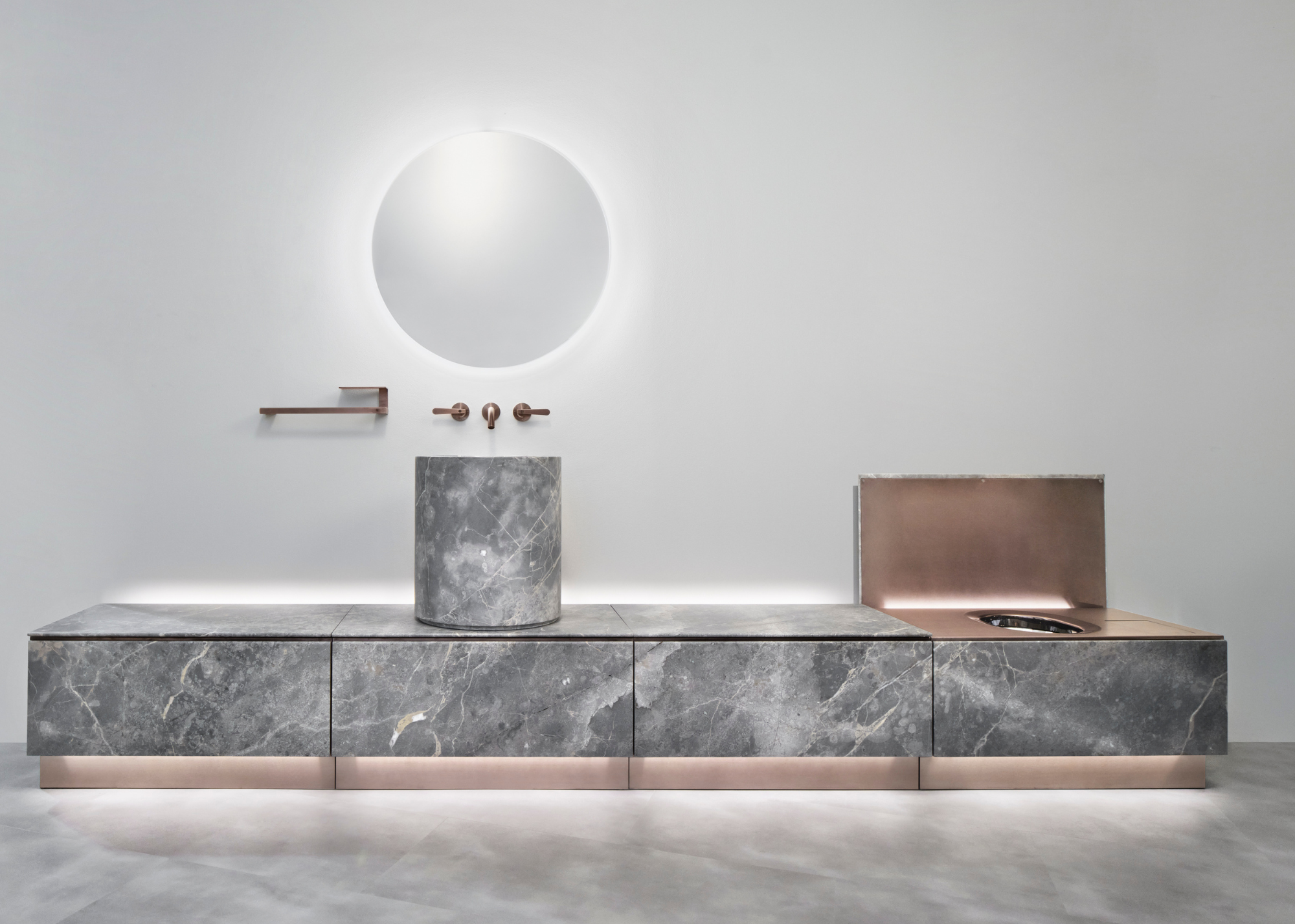 a grey marbled modular toilet design with an integrated toilet and tall basin sink