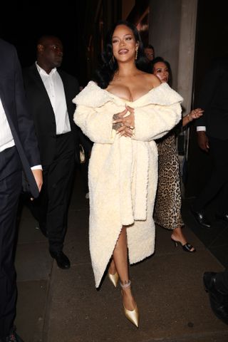 Rihanna attends the launch of Fenty Hair exclusively at Selfridges on September 16, 2024 in London, England wearing a shearling coat