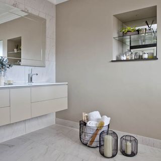 bathroom with walled storage and baskets