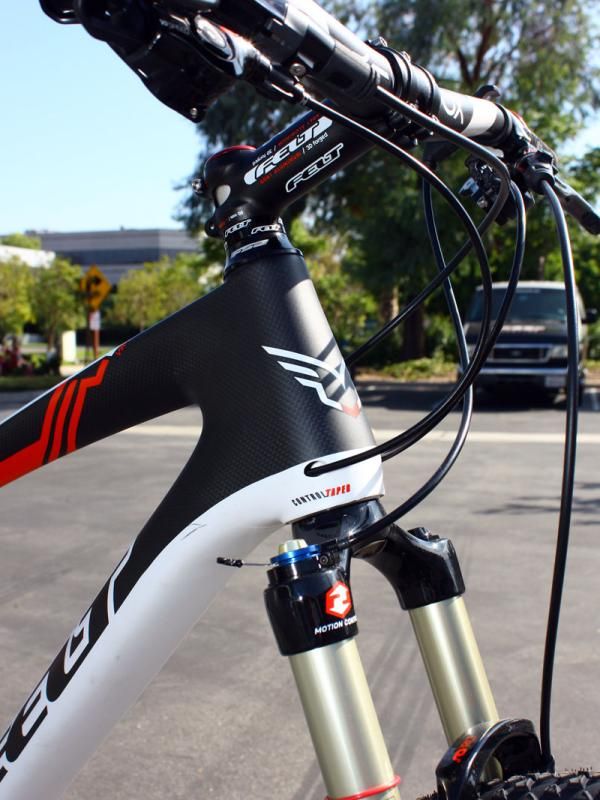 Derailleur housing is fed into the frame at the bottom of the tapered head tube.