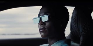 Lashana Lynch as Nomi making a cool entrance in her Jaguar during the final trailer for No Time to Die