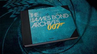 Taschen's The James Bond Archives, pictured in a gun barrel.