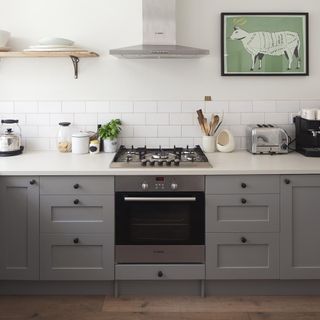 White kitchen with metro tiles and grey cabinetry