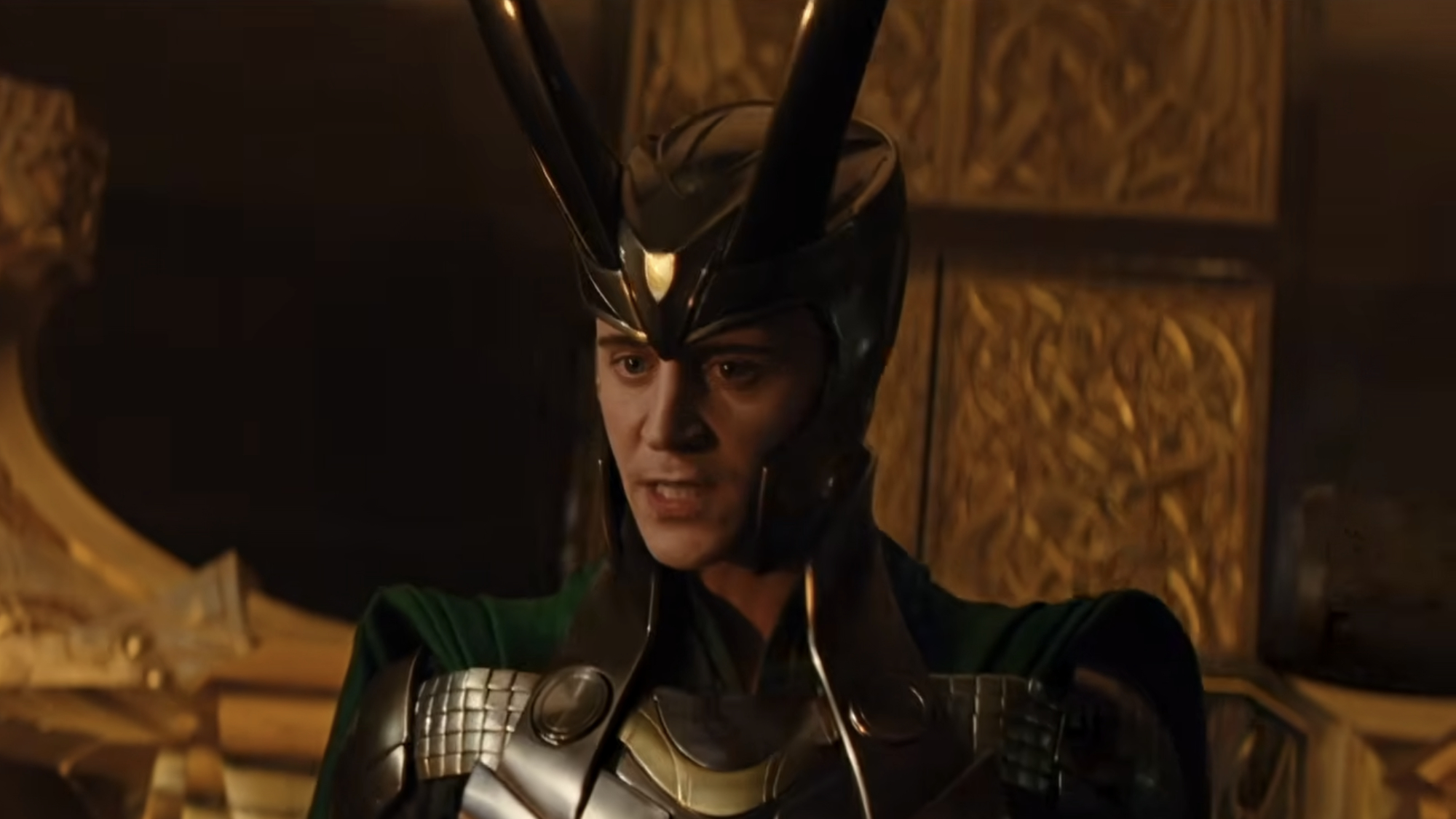 Loki (Tom Hiddleston) speaks to Lady Sif and the Warriors Three about Odin's condition in Thor.