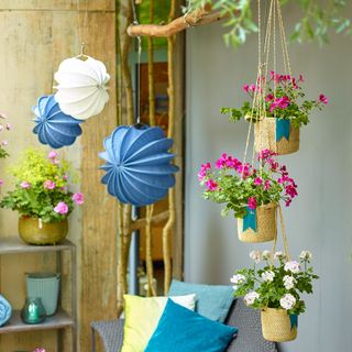 decking-decoration with hanging flower pots and pillows