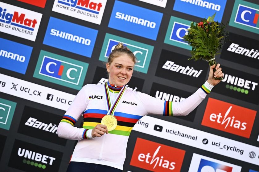Dutch Fem Van Empel celebrates on the podium after winning the women elite race, at the UCI Cyclocross World Championships, in Lievin, France, Saturday 01 February 2025. The world championships are taking place from 31 January until 02 February.BELGA PHOTO JASPER JACOBS (Photo by JASPER JACOBS / BELGA MAG / Belga via AFP)