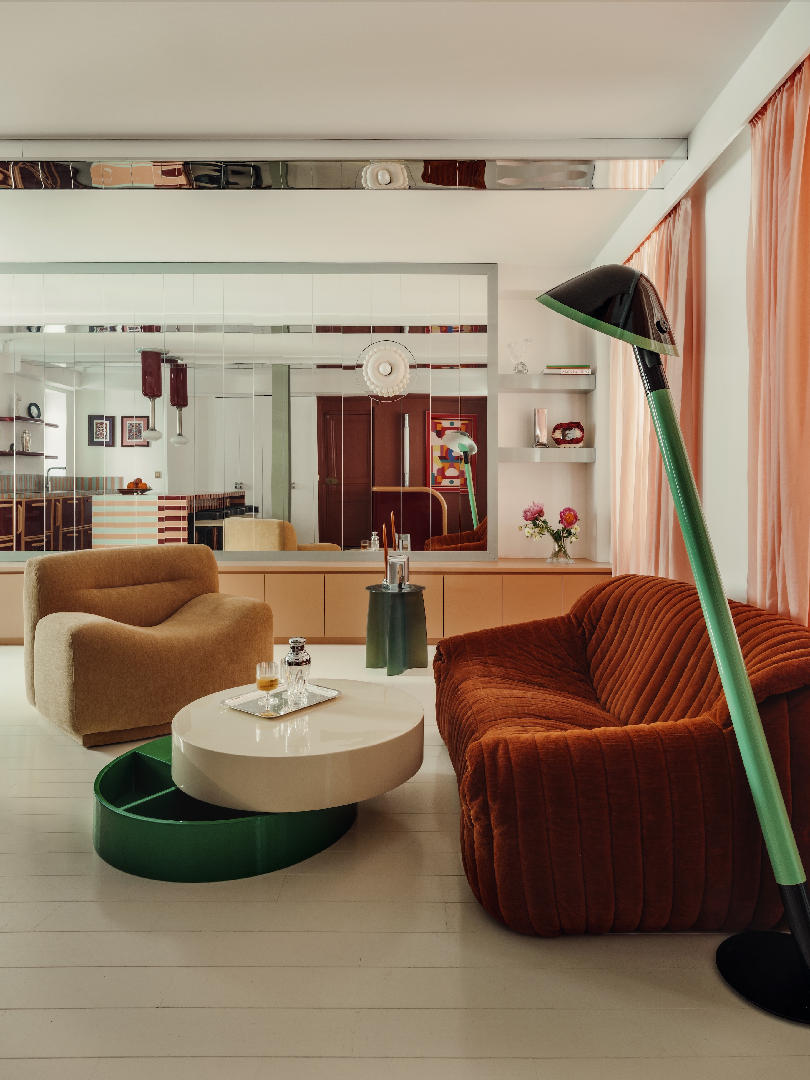 A living room with a glossy palette and vintage furniture and decor.