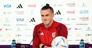 Wales captain Gareth Bale hints at his Wales future in press conference ahead of England clash: Gareth Bale of Wales reacts during the Wales Press Conference at the Main Media Center on November 28, 2022 in Doha, Qatar.