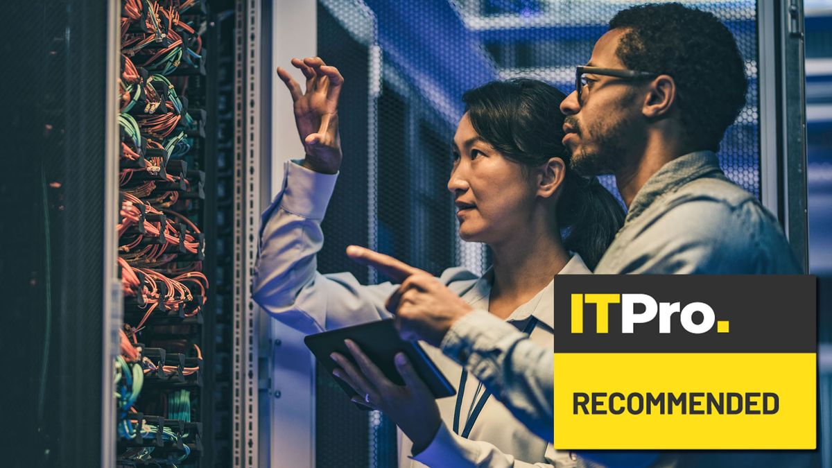 man and woman working in data centre on server rack