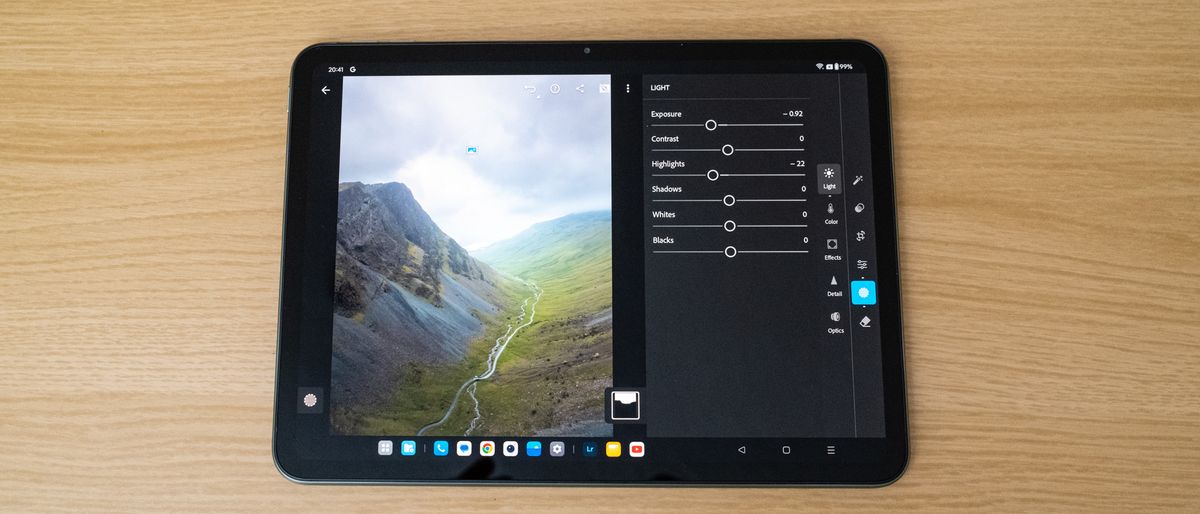 OnePlus Pad Go showing the Lightroom app on a wooden table