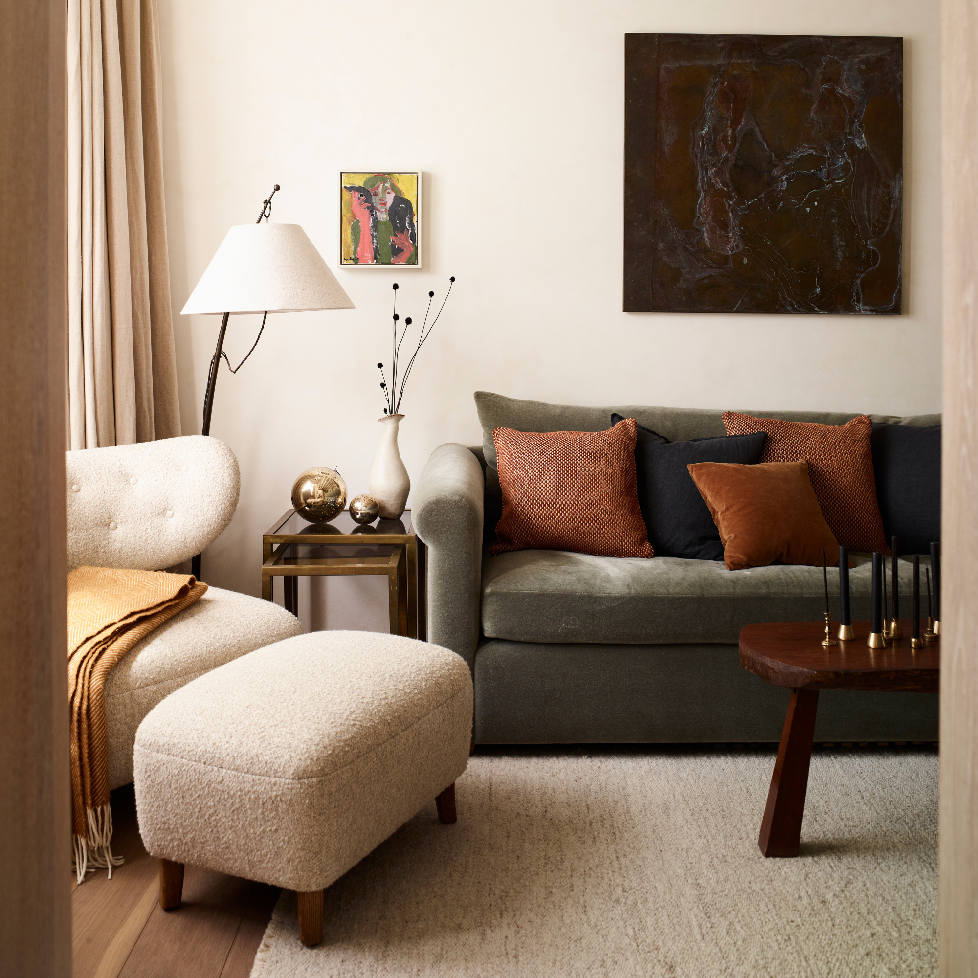 Drak green sofa and dark wood coffee table in neural living room.