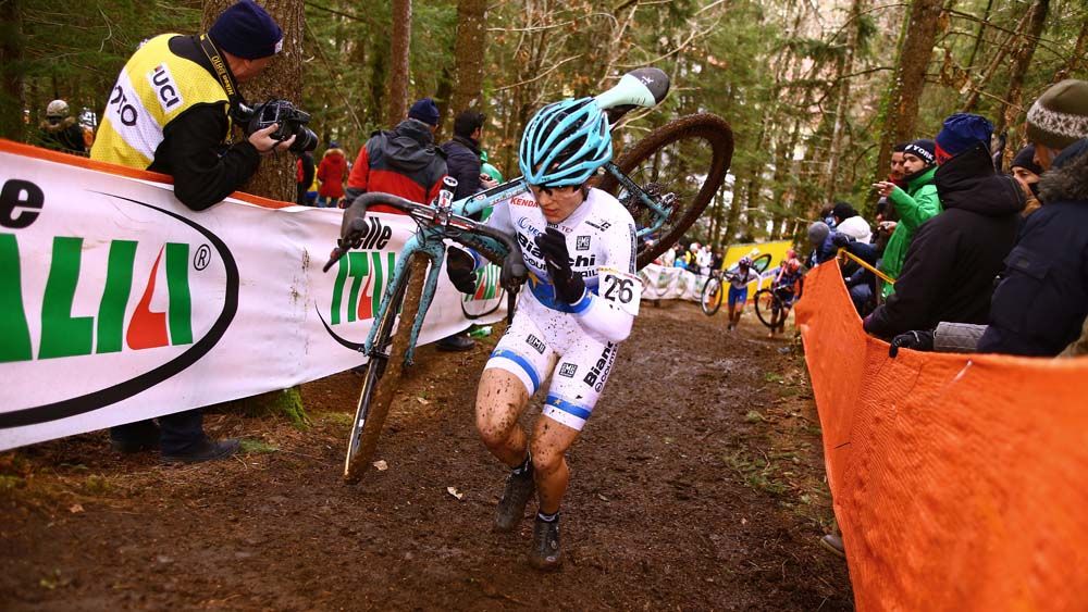 Chiara Teocchi runs up a muddy section of course