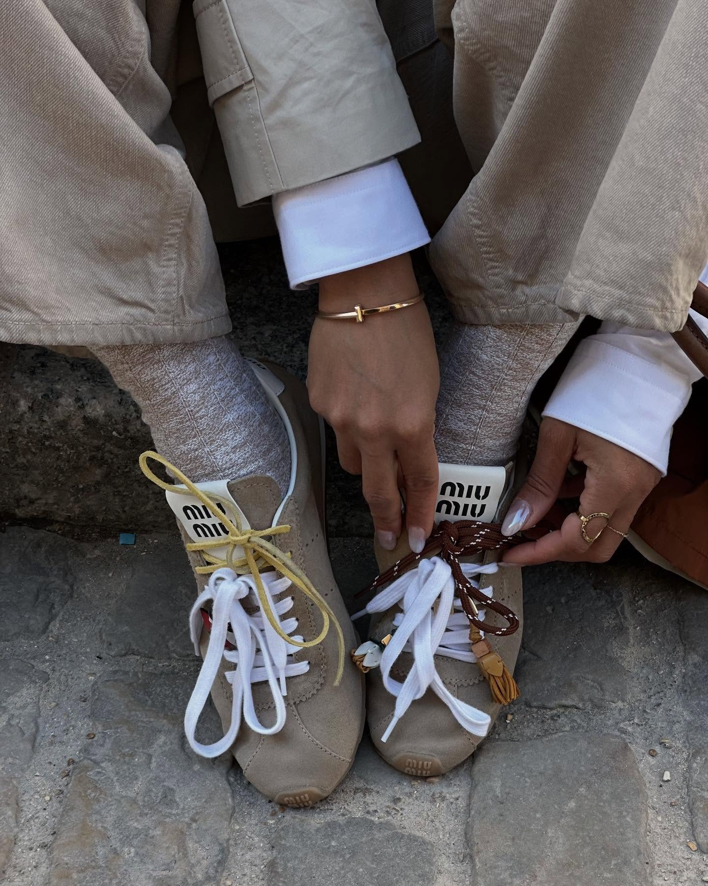 French trainer trends 2025: @slipintostyle wears brown Miu Miu trainers