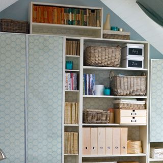 living room with bespoke cupboard for storage