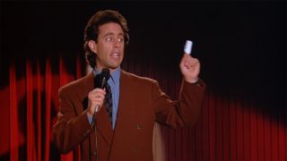 Jerry doing standup with a cut finger in The Bris episode of Seinfeld