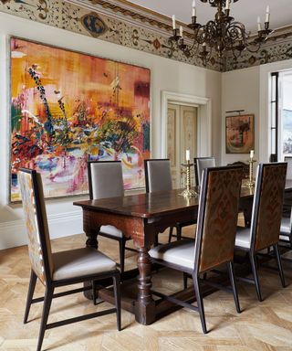 Dining room with traditional chairs, tables and colorful art