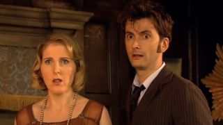 Fenella Woolgar and David Tennant stand shocked in the library in Doctor Who.