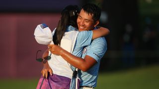 CT Pan celebrates his bronze medal with his caddie