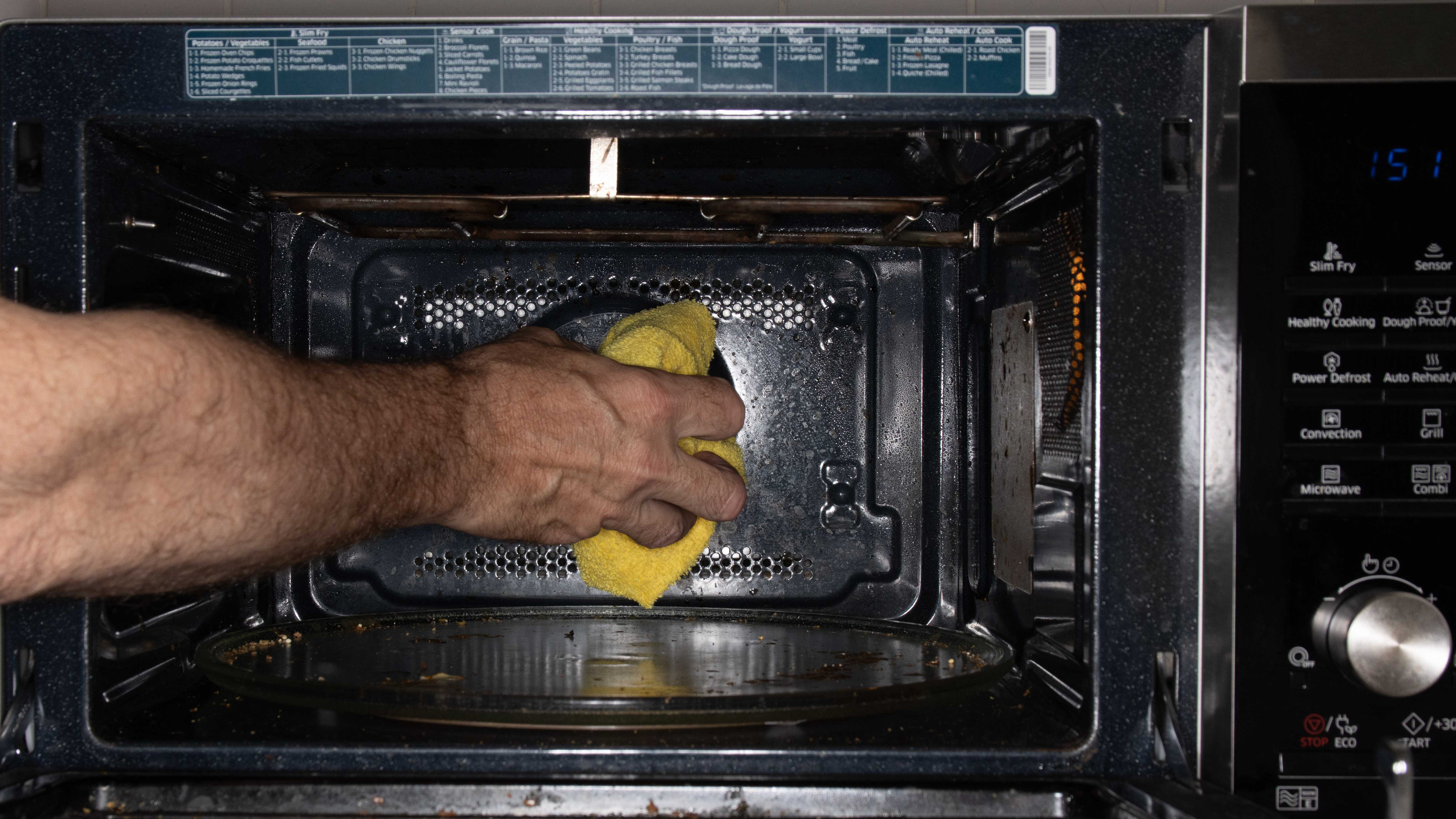 Cleaning the microwave oven